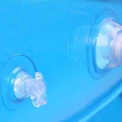Extreme closeup of the air valve of an inflatable swimming pool